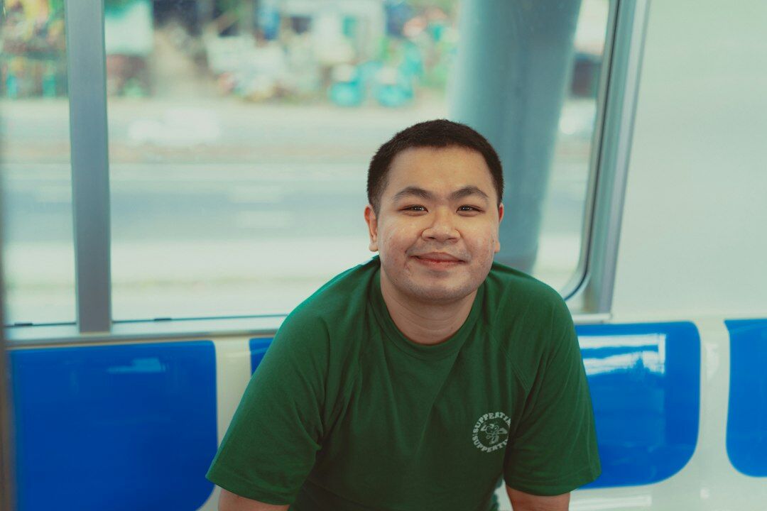 Portrait of a friendly Japanese man staff member smiling