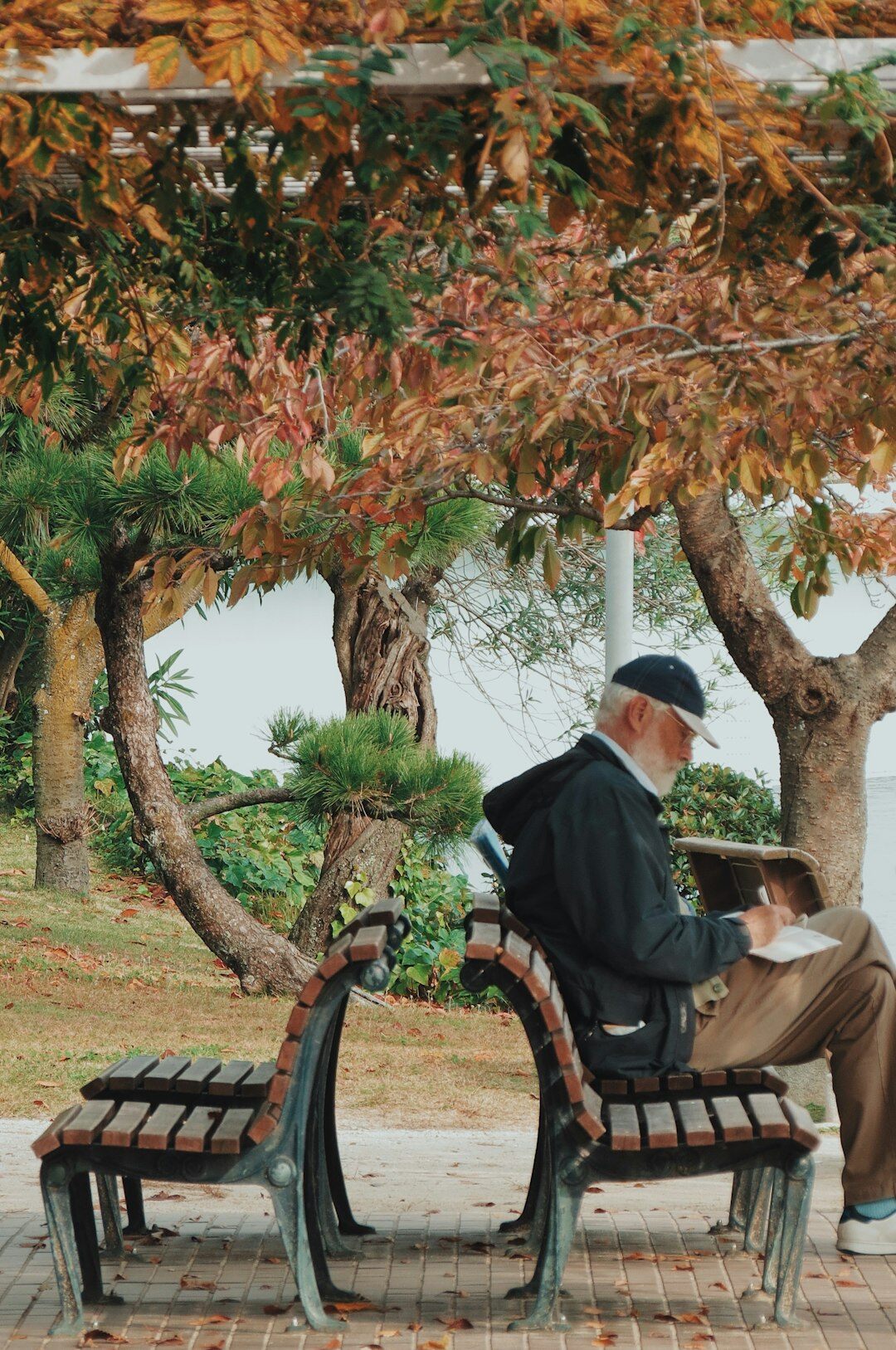 Elderly Japanese couple smiling while using a tablet together