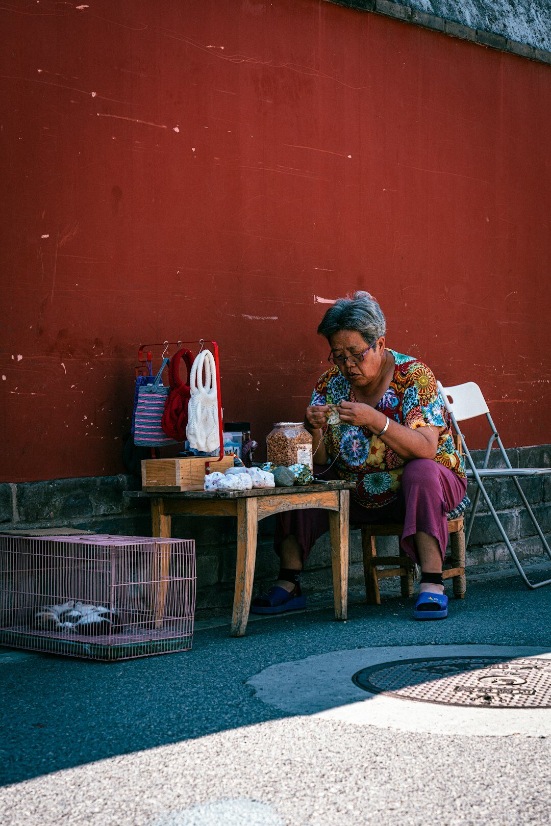 Senior Japanese woman writing in a planner calendar
