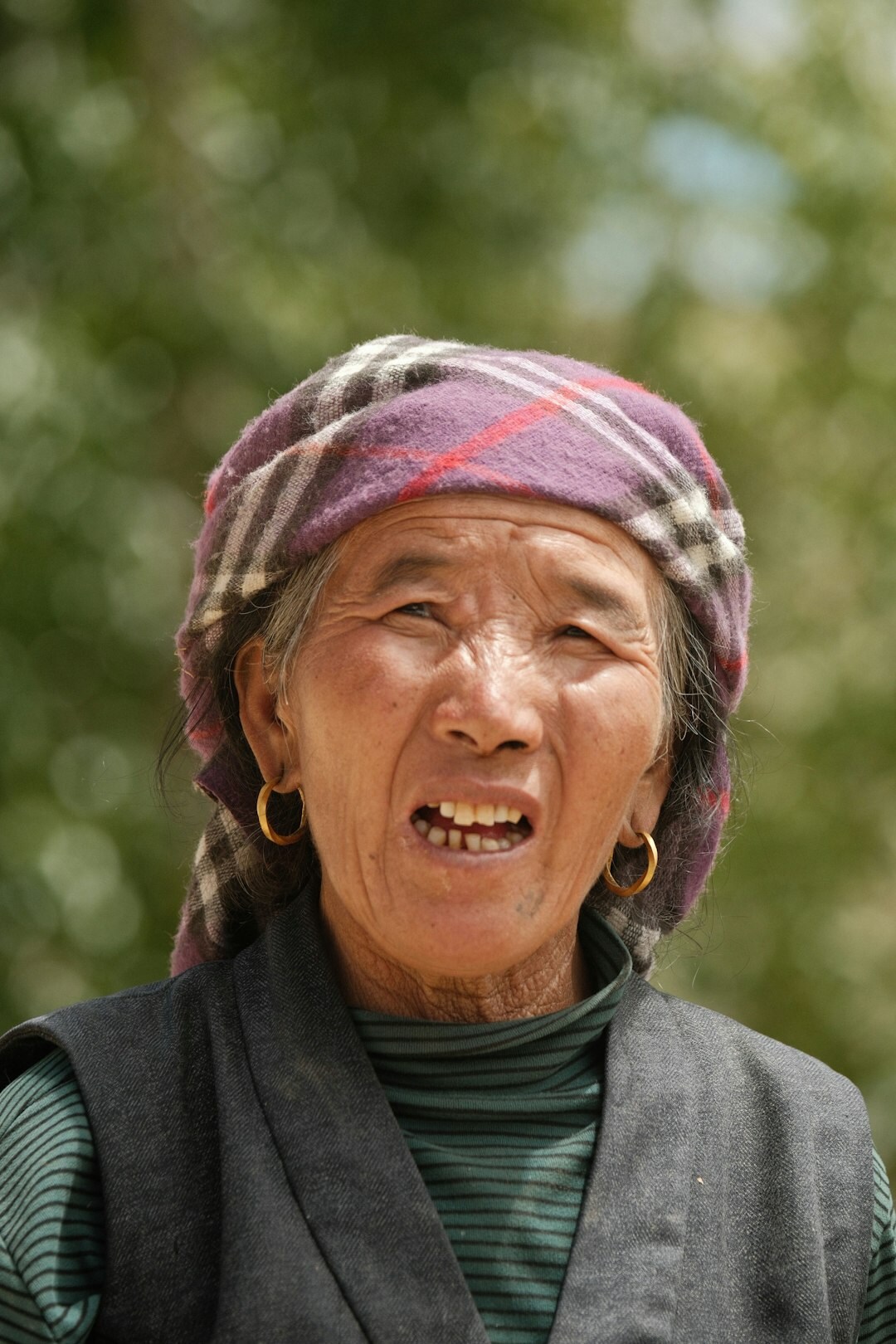 Portrait of a joyful elderly Japanese woman laughing